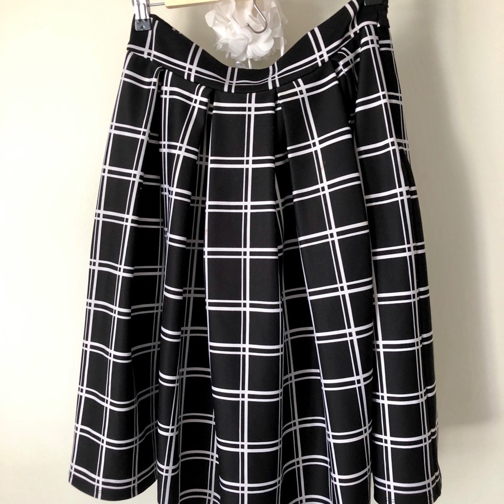 Black and white, plaid, tea length skirt.
